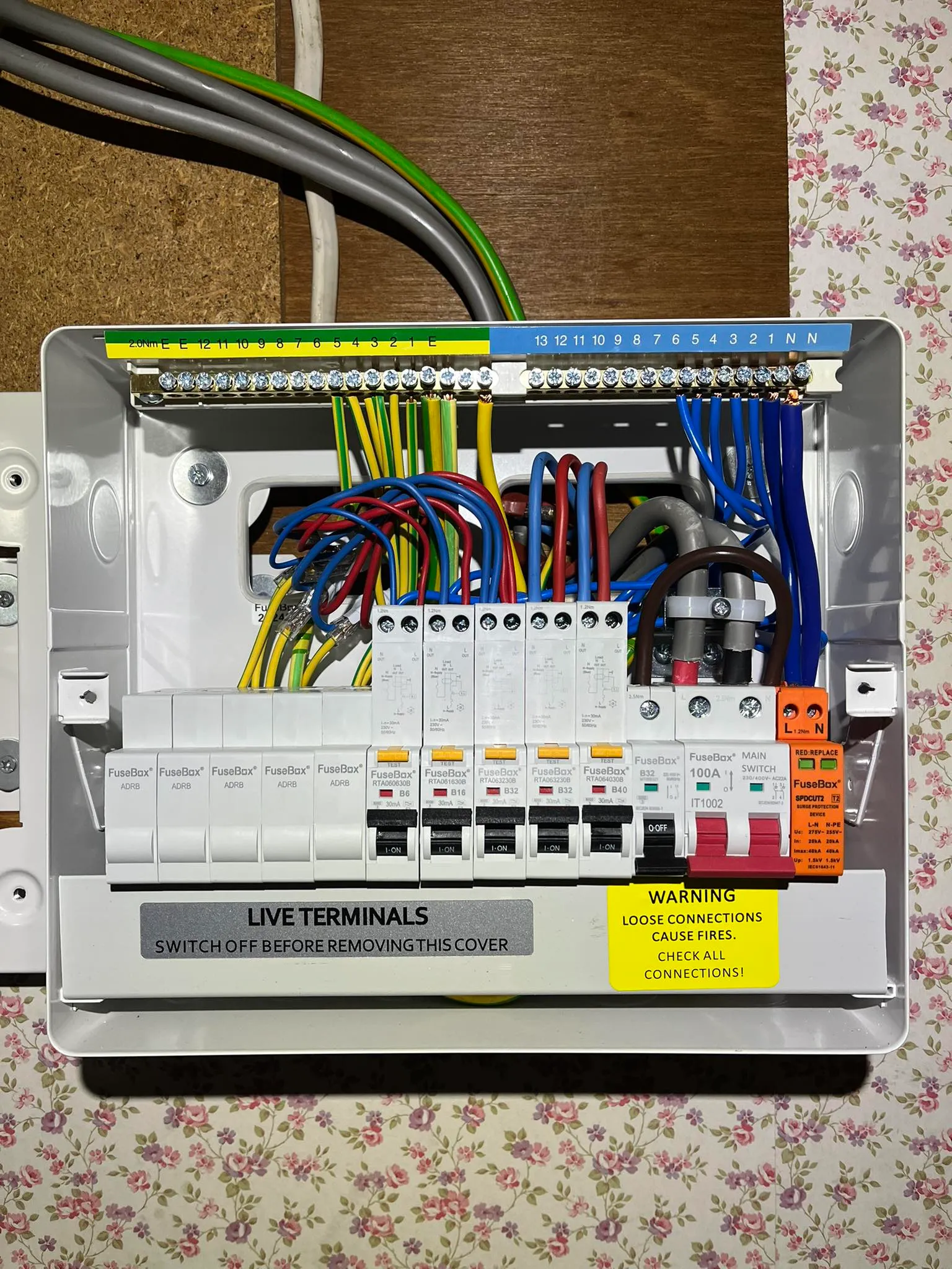 An electrical panel with multiple wires and wires attached to it.